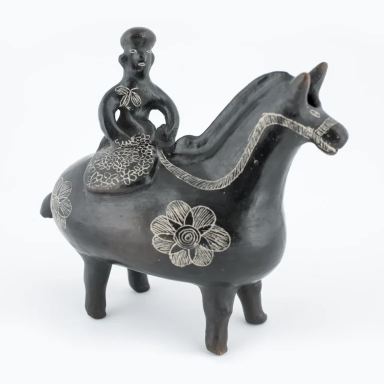 Figurilla de caballo con jinete mujer
